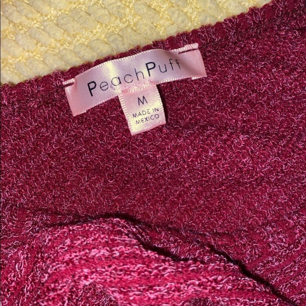 Plunge neck puff sleeve sweater.